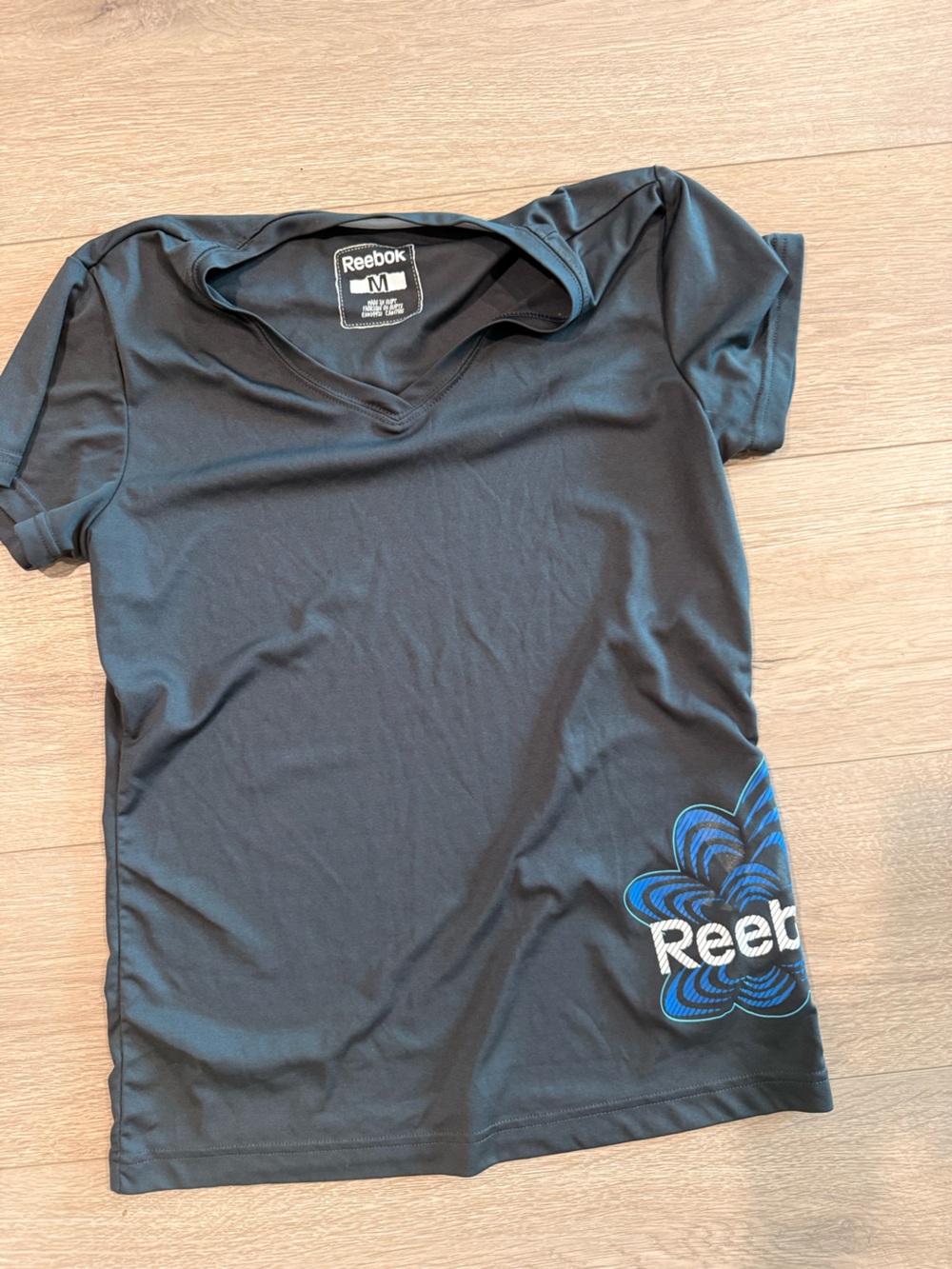 Reebok Men’s Black Short Sleeve Tee with Blue Graphic Accent